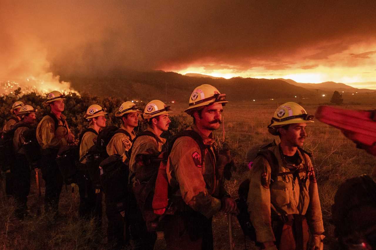 Firefighters from Cal Fire's Placerville station monitor the Sugar Fire, part of the Beckwourth Complex Fire, in Doyle, Calif., on Friday, July 9, 2021. (AP Photo/Noah Berger)