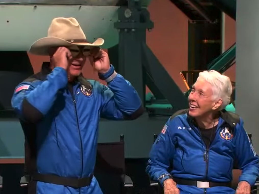 jeff bezos holds amelia earhart's goggles