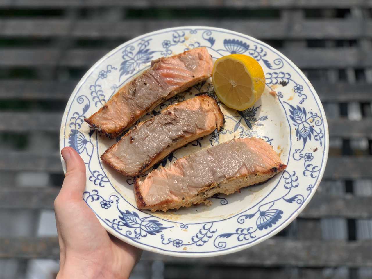 Cooked salmon on plate with lemon