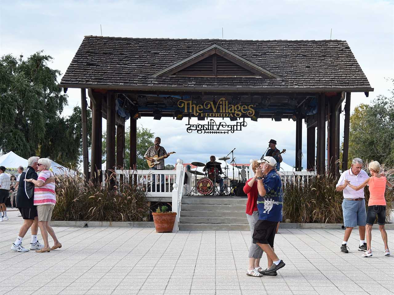 Residents dance in the square of The Villages retirement community in 2016.