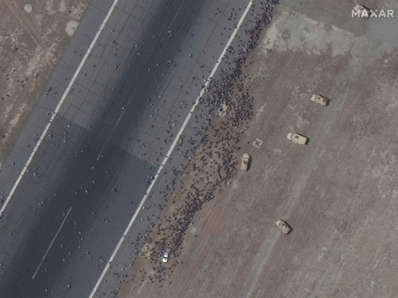 satellite images show Afghani people on Kabul airstrip