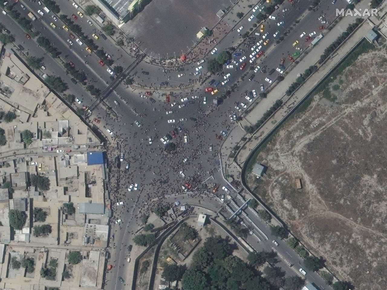 Satellite image shows Afghani people near entrance to Kabul's airport