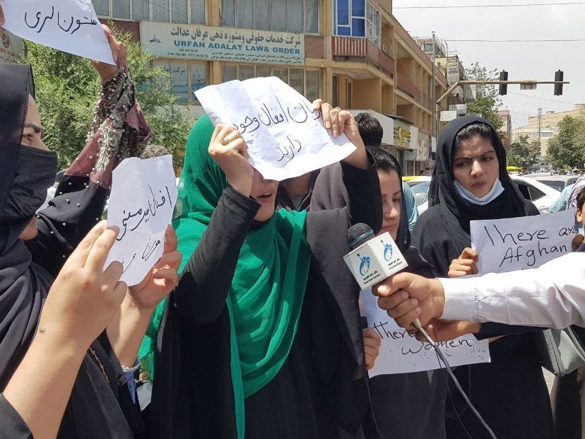 Afghan women, holding placards, gather to demand the protection of Afghan women's rights in front of the Presidential Palace in Kabul, Afghanistan on August 17, 2021.