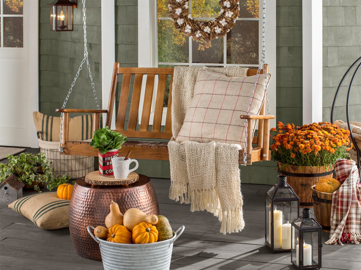 Front porch with swing and other fall decor