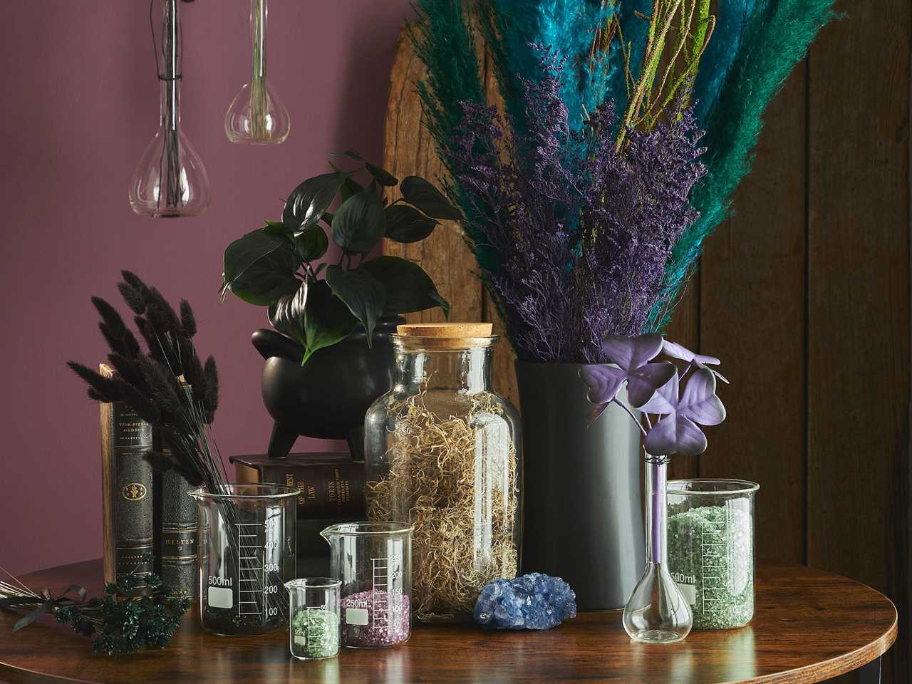 Image of glass beakers and containers filled with colorful stones from Michael’s best fall decor 2021
