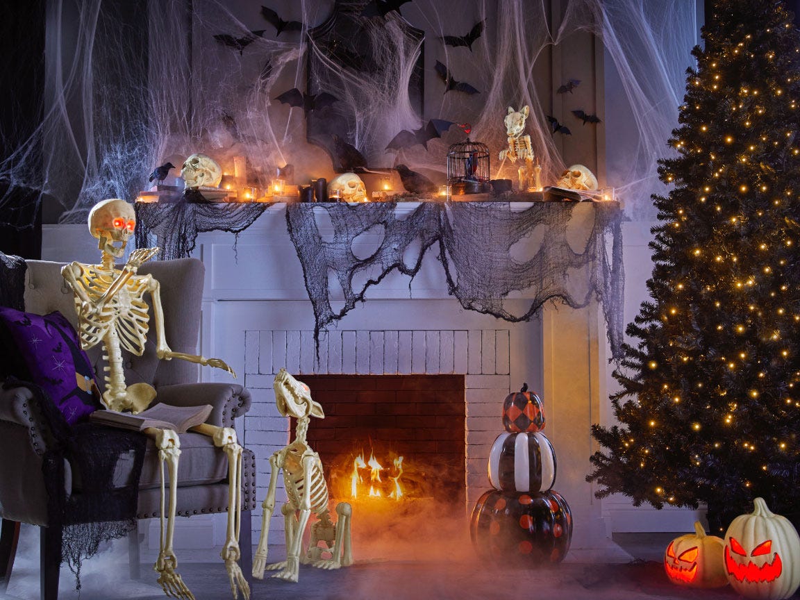 Image of human and dog skeleton Halloween decorations in front a fireplace from Home Depot, best halloween decorations 2021