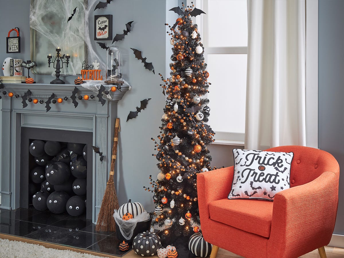 Image of a Halloween tree next to a mantle with Halloween decorations from Michael’s best Halloween decorations 2021