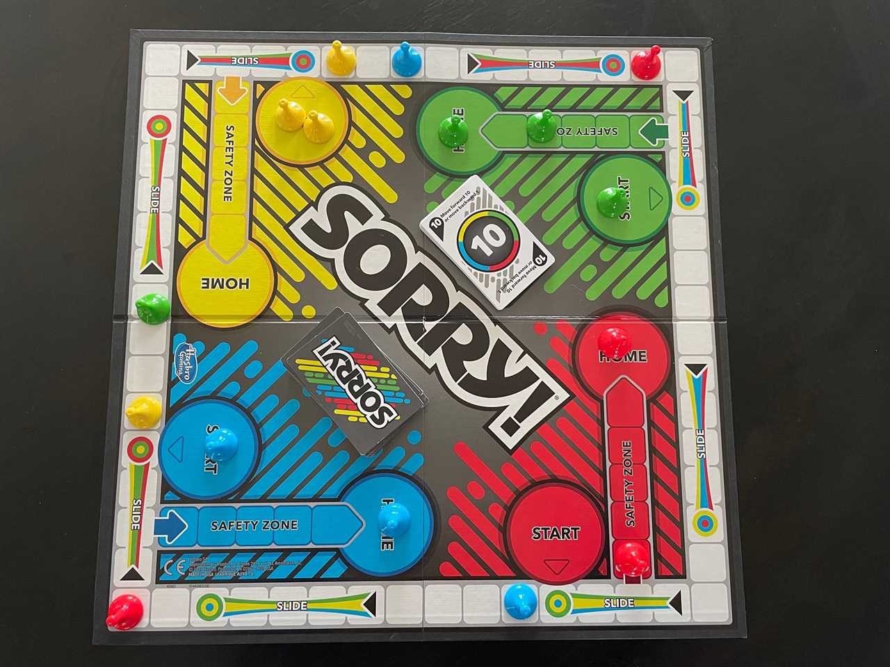 Image of Sorry! laid out on a table with the figurines and cards on it, best board games 2021