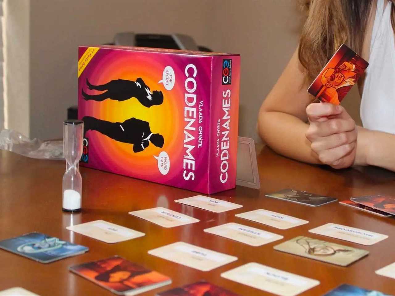 Woman at table playing Codenames board game