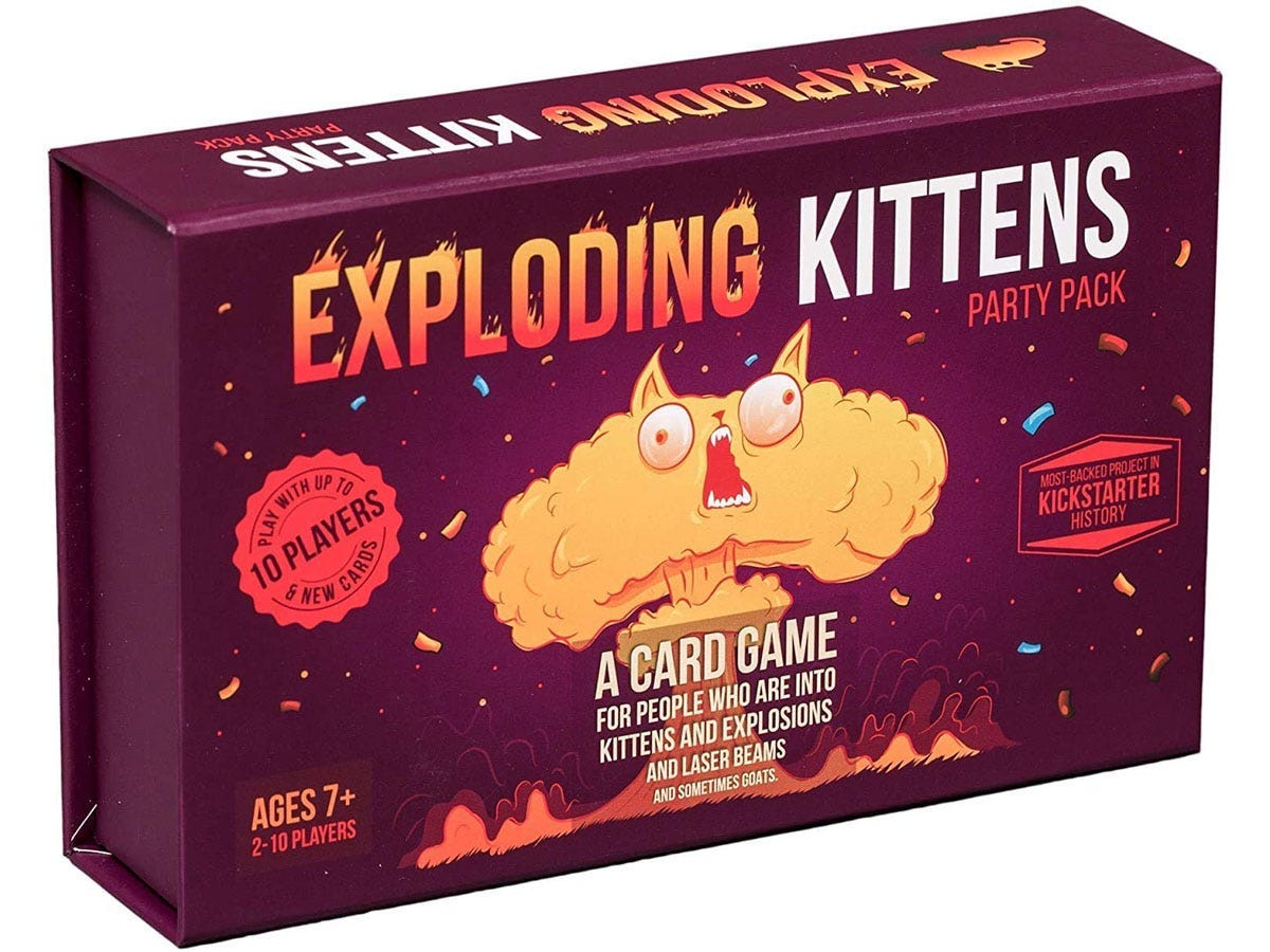 Image of the red, purple, and orange board game box for Exploding Kittens, best board games 2021