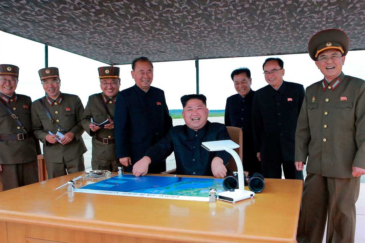 Kim Jong Un smiles during inspection of North Korean missile site