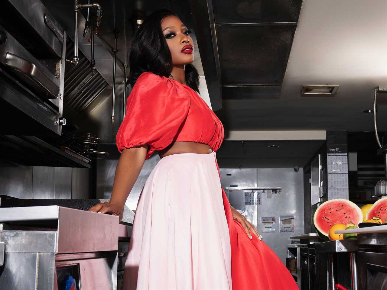 Anne Onyeneho standing in her kitchen posing