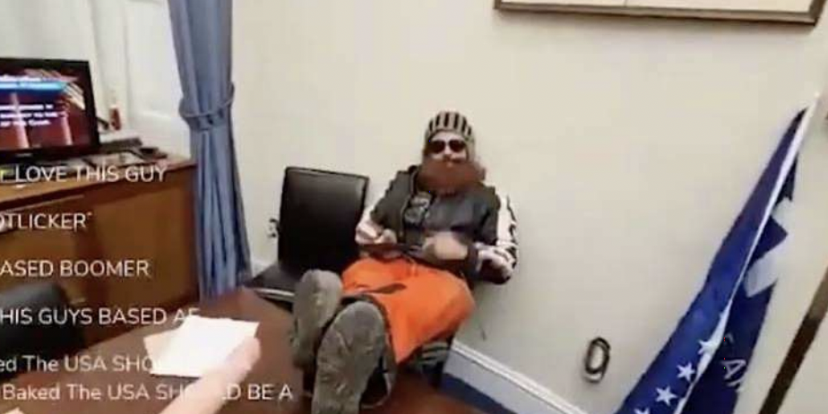 Brandon Fellows in the US Capitol on January 6 with his feet up on a table.