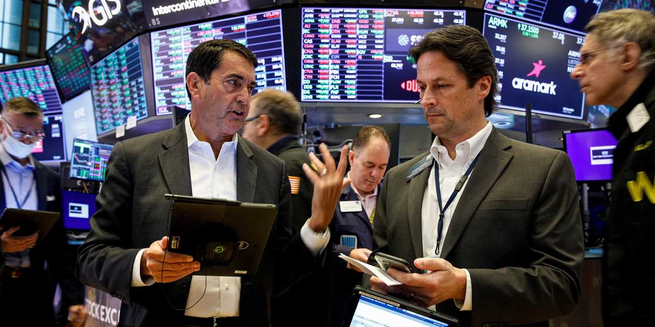 Traders work on the floor of the New York Stock Exchange (NYSE) in New York City, U.S., October 12, 2021.