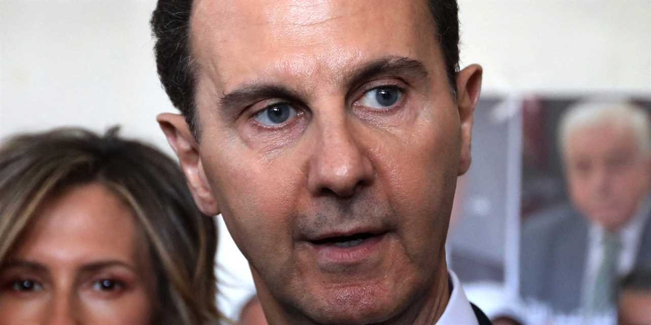 Syrian President Bashar al-Assad (R) accompanied by his wife Asma speaks to members of the press after casting their votes at a polling station in Douma, near the capital Damascus on May 26, 2021, as voting began across Syria for an election guaranteed to return Assad for a fourth term in office. - The 55-year-old president, who has been in power since 2000, is sure to keep his job after the election, every aspect of which is controlled by him and his Baath party. He faces former state minister Abdallah Salloum Abdallah and Mahmoud Merhi, a member of the so-called "tolerated opposition", long described by exiled opposition leaders as an extension of the regime. (Photo by LOUAI BESHARA / AFP) (Photo by LOUAI BESHARA/AFP via Getty Images)