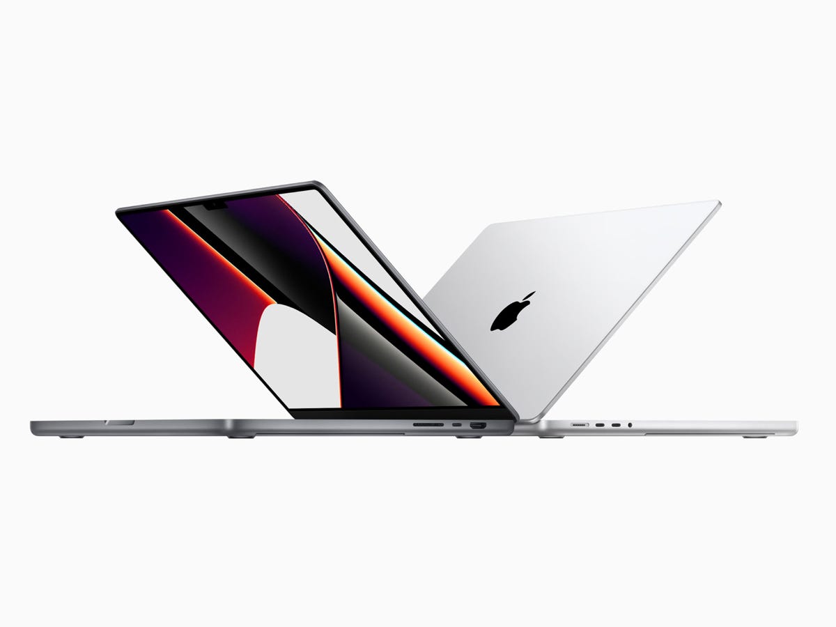 Two sizes of Apple's 2021 MacBook Pro with screens partially closed in silver and space gray