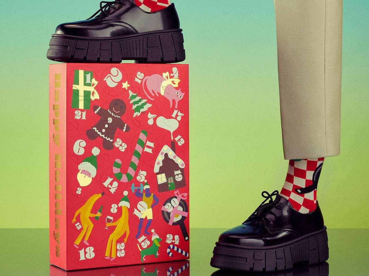 Image of foot resting on Happy Socks advent calendar for best advent calendars 2021