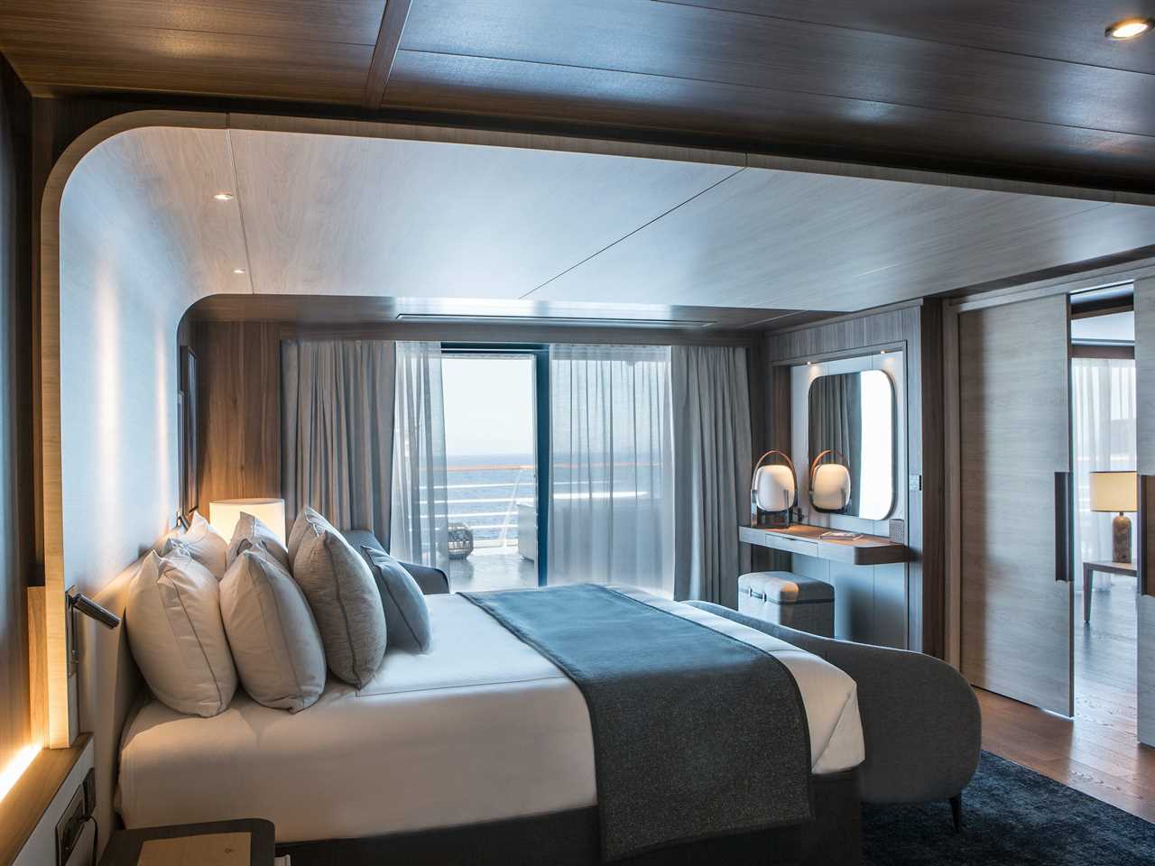 a bedroom by large windows