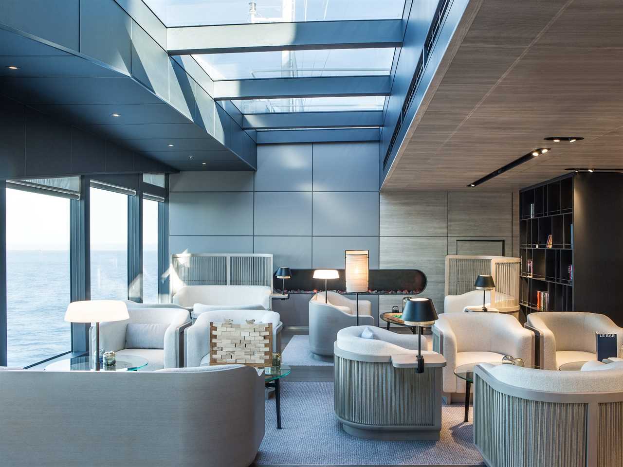 a lounge area under skylights