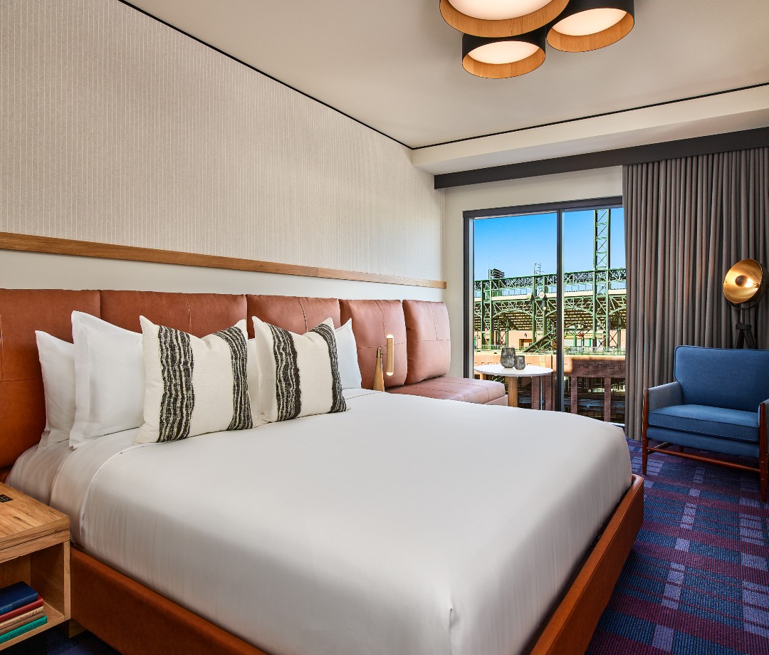 Hotel room with view of green baseball stadium