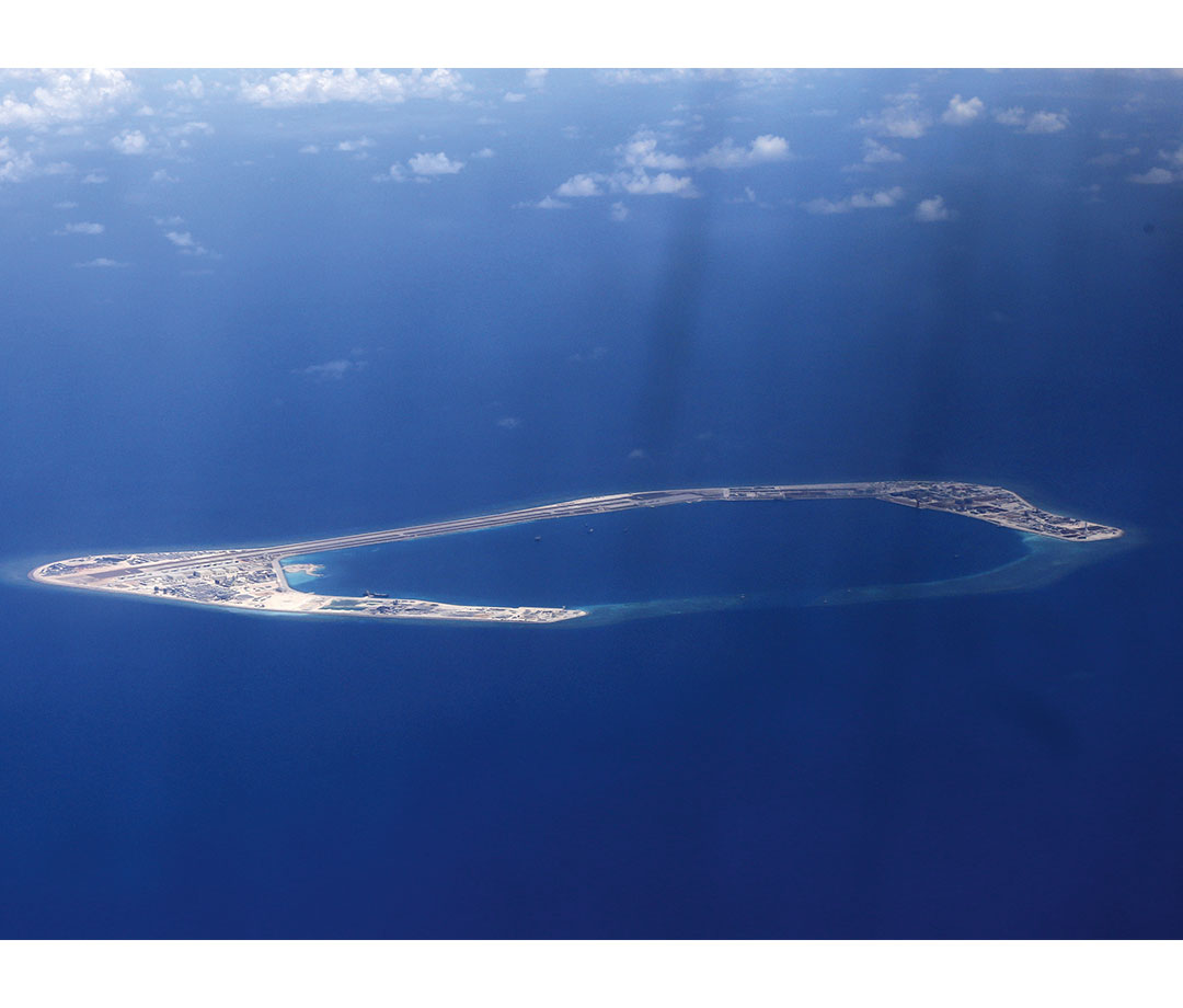 Aerial view of reef in blue water