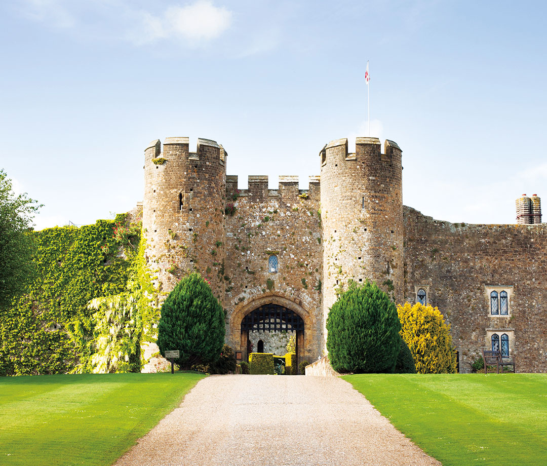 Stone castle with green grass below