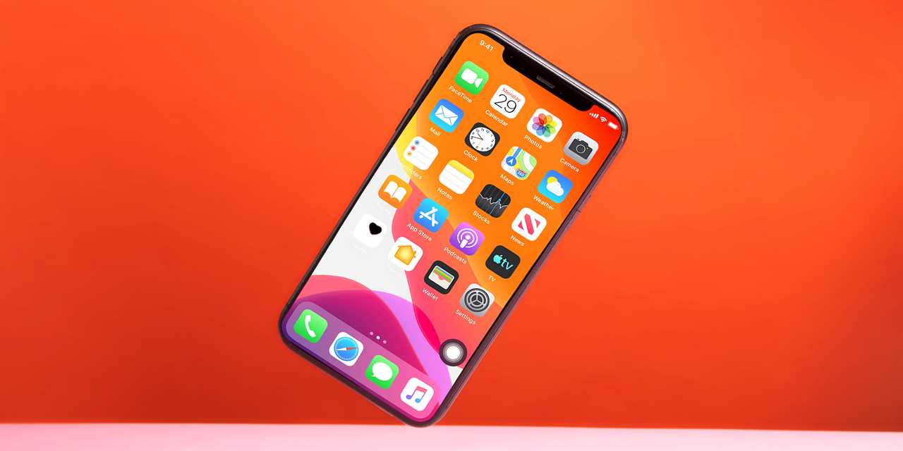 An iPhone balanced on its edge.