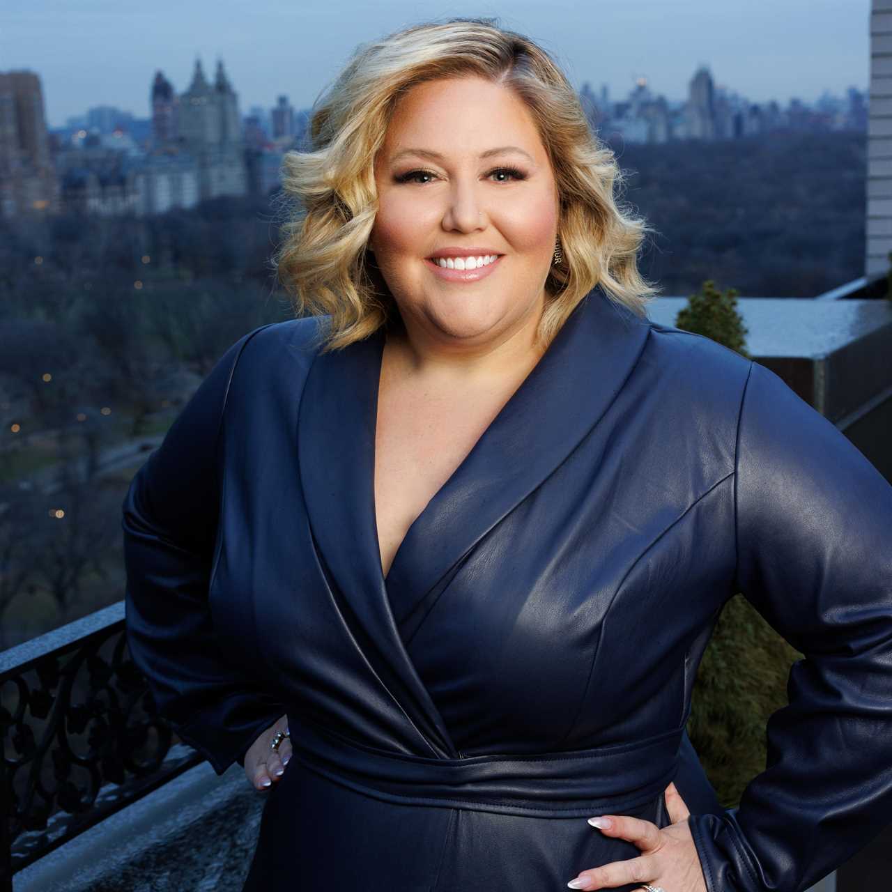 Kathleen Cameron in front of a city skyline