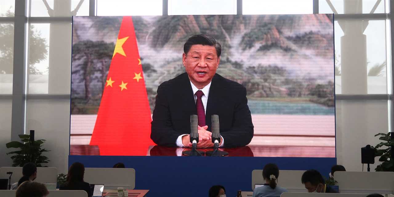 A screen shows Chinese President Xi Jinping delivering a keynote speech at the opening ceremony of the Boao Forum for Asia via video link, at a media centre in Boao, Hainan province, China April 21, 2022. REUTERS/Kevin Yao