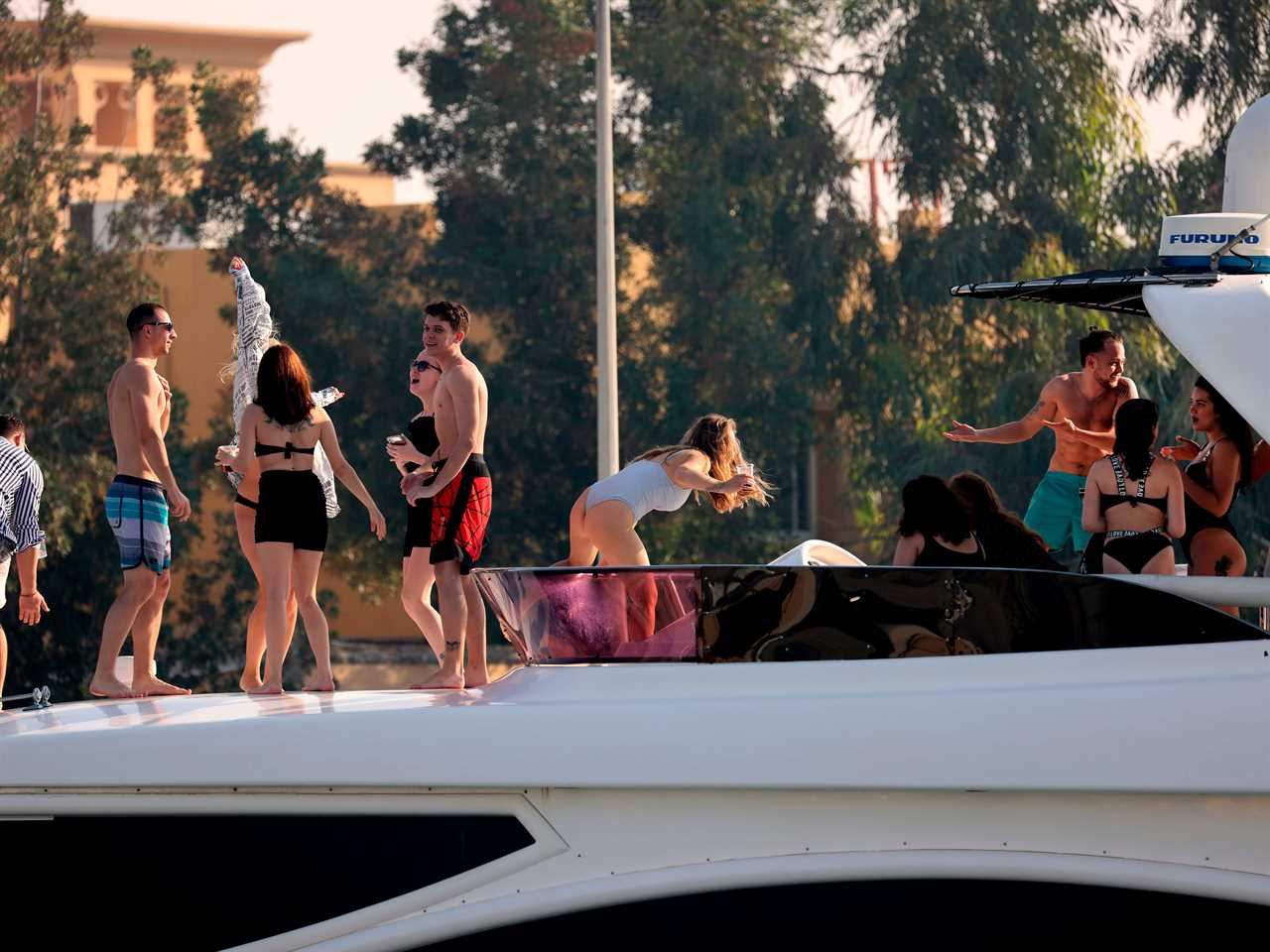 Expats partying on a luxury yacht on Dubai creek.