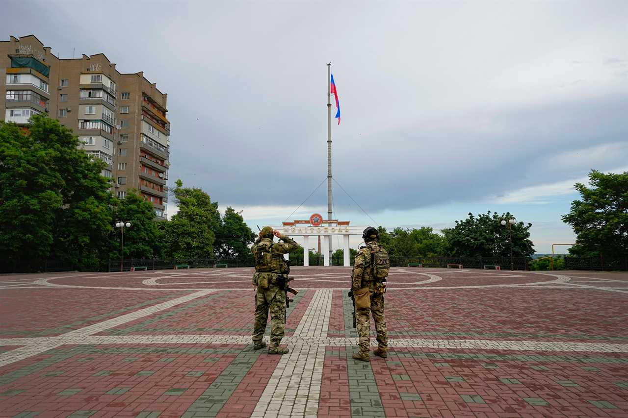 Russian soldiers guard an area under Russian military control in Melitopol, the Zaporizhzhia region, Ukraine on June 14, 2022