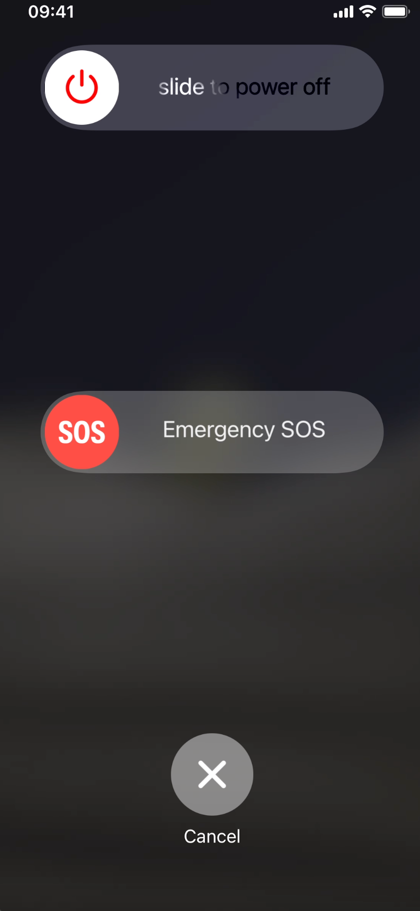 An iPhone screen showing the “slide to power off” slider at the top.