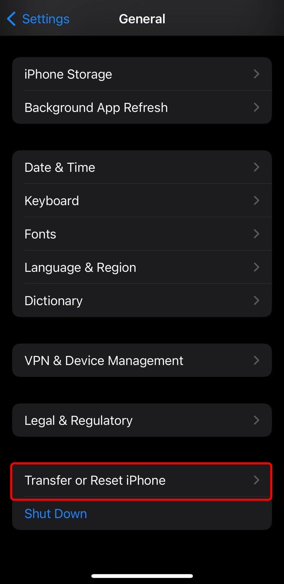 The General settings on an iPhone, with the “Transfer or Reset iPhone” option highlighted.
