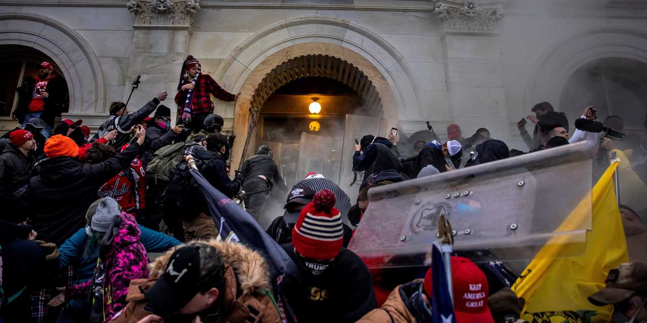 Trump supporters attempt to enter the Capitol during the Jan 6 attack