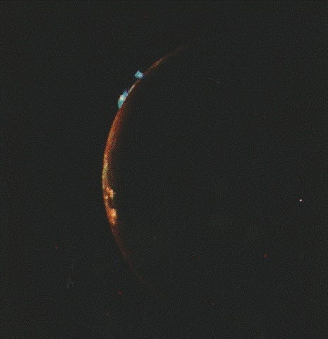 Volcanic activity captured on the surface of Io, Jupiter's moon, by the Voyager probes.