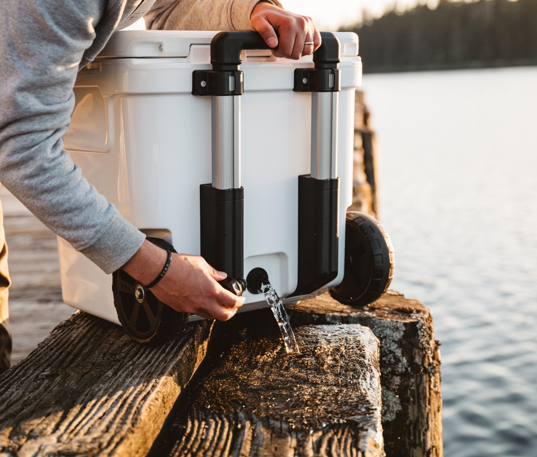 Man emptying water from cooler spout