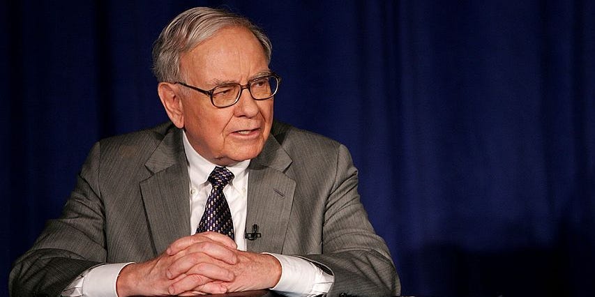 Warren Buffet at a conference with Bill and Melinda Gates