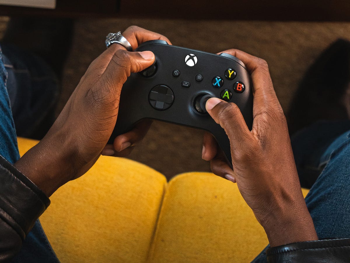 a person holds a Xbox Core Wireless Controller as one of the best tech products under $50