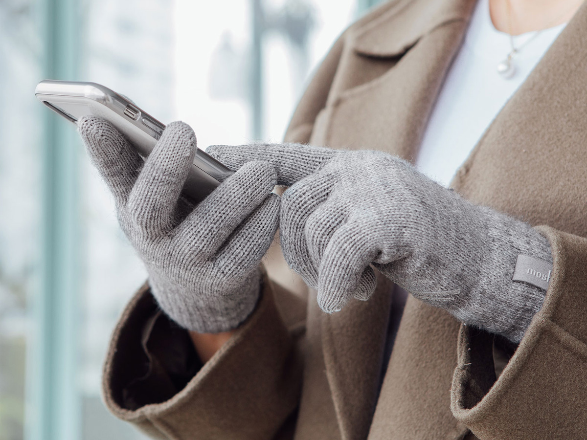 Digits gloves in use with a smartphone as one of the best tech products under $50