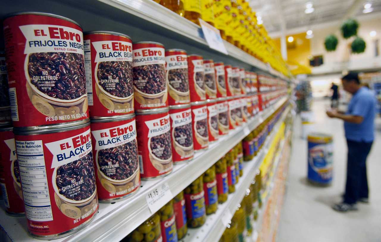 black bean cans grocery store shelf
