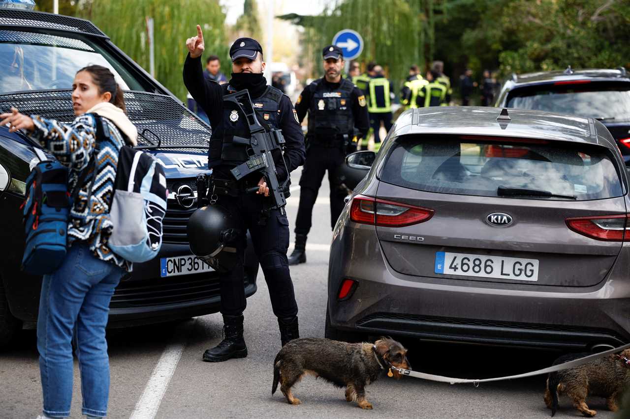 Police stands outside of Ukrainian embassy after, Spanish police said, blast at embassy building injured one employee while handling a letter, in Madrid, Spain November 30, 2022