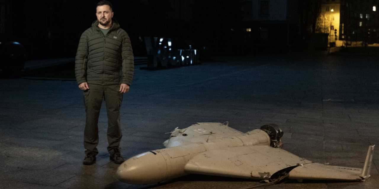 Ukrainian President Volodymyr Zelenskyy stands next to an Iranian-made Shahed-136 drone.