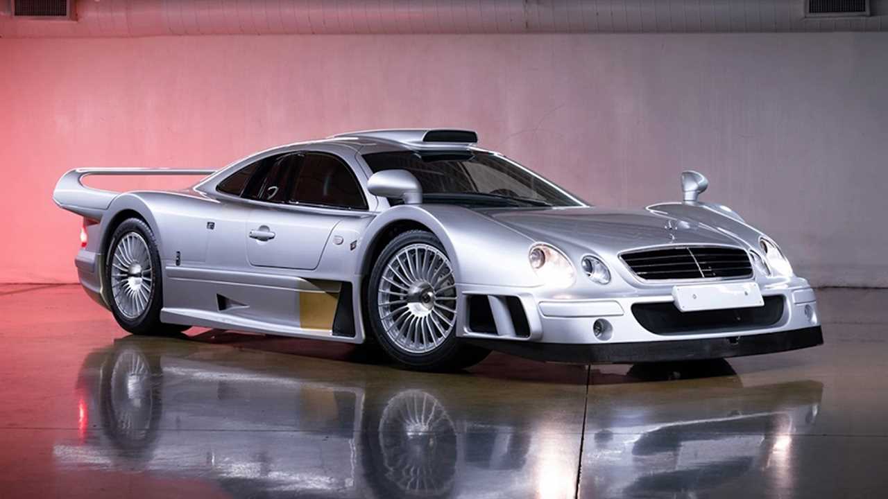 Mercedes-Benz race car on a muted pink background in a studio.