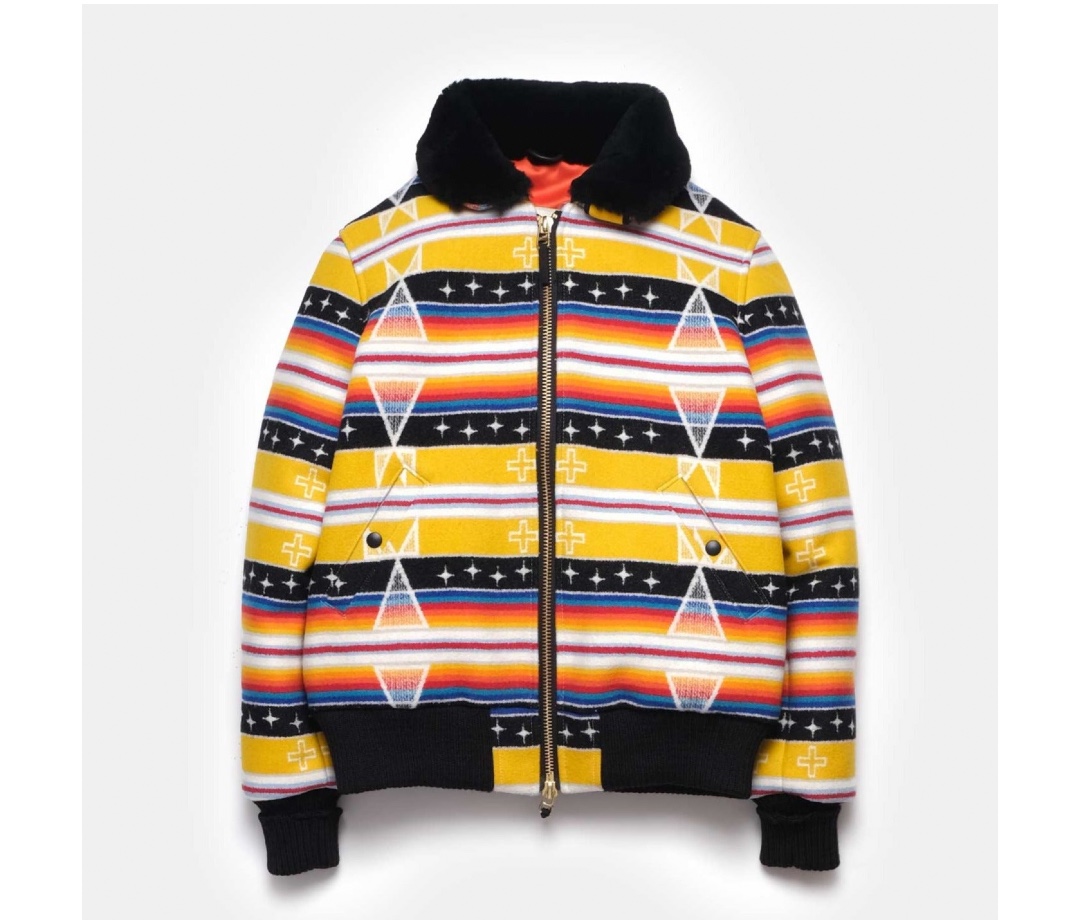 Striped yellow, black, and red wool jacket on an off-white background.