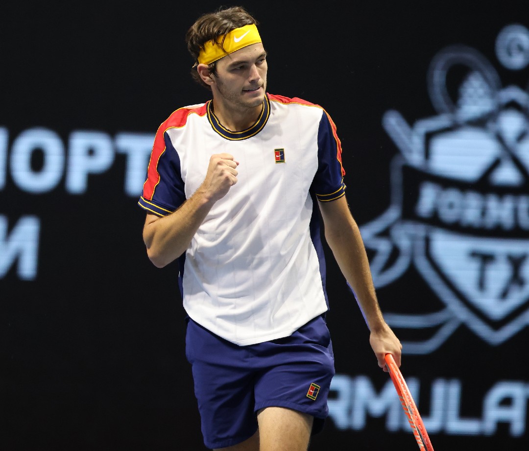 Taylor Fritz pumps his fist during a match.