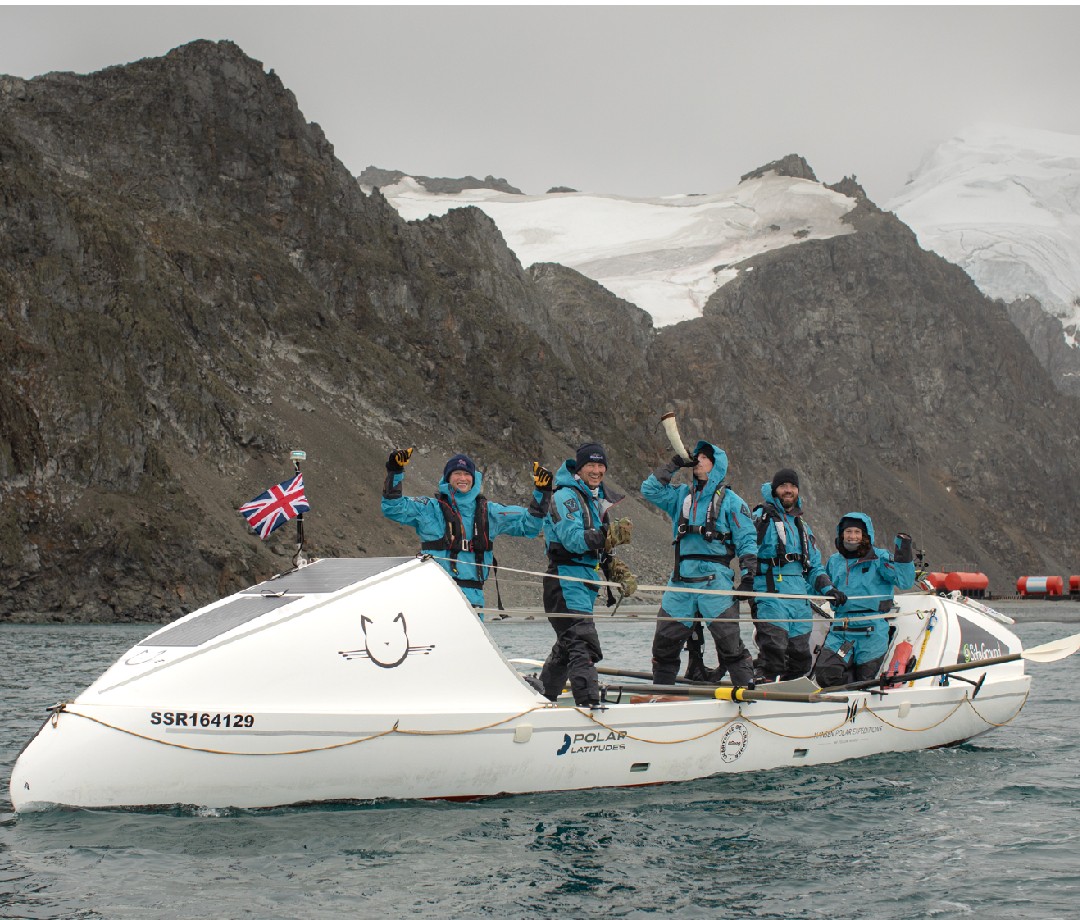 Crew having a moment of levity on the boat just off the Antarctic coast.