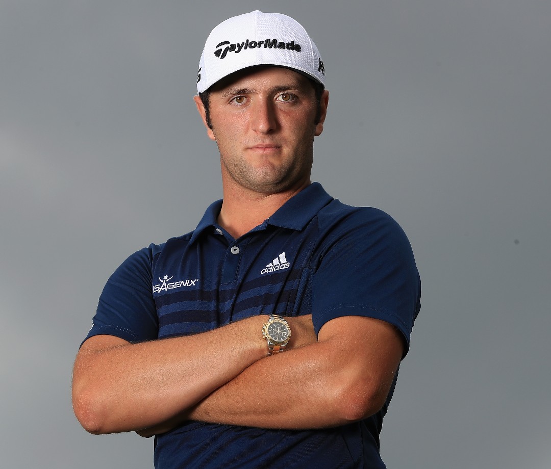 Jon Rahm with arms folded.