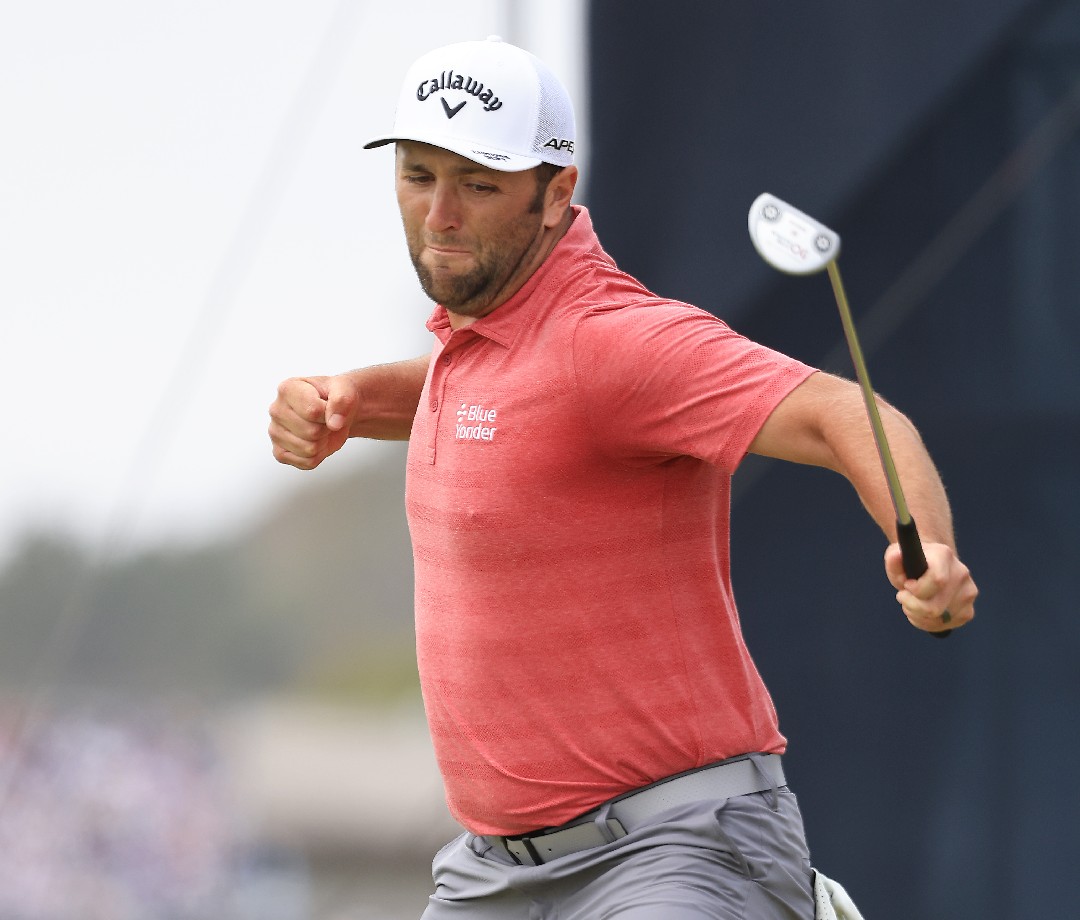 Jon Hahm on the course, pumping his fist.