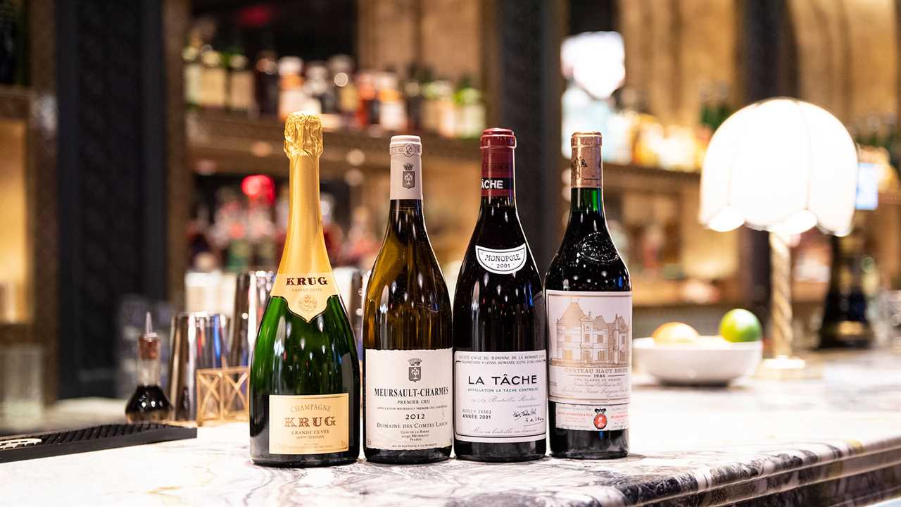 Four bottles of wine on bar top