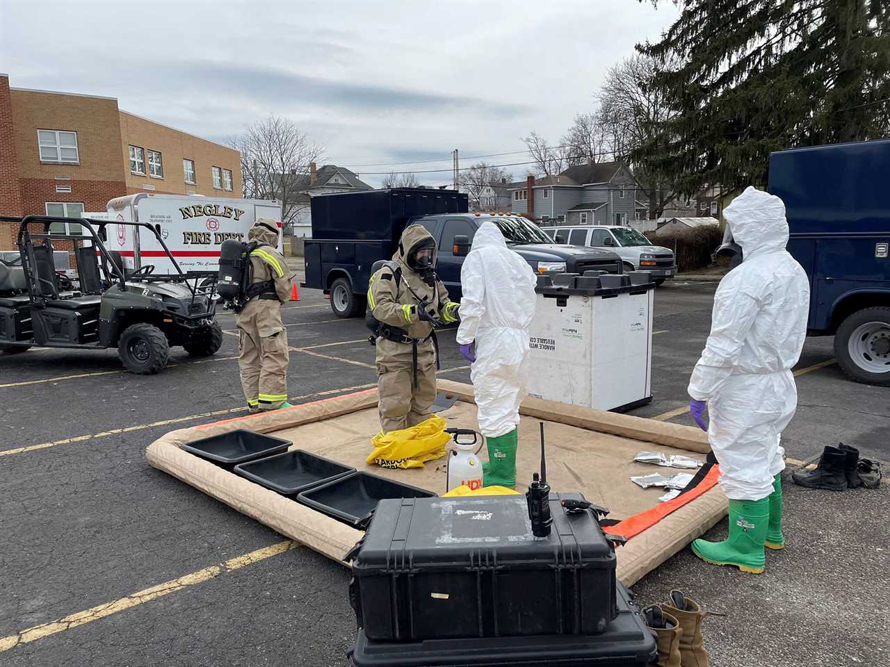 ONG 52nd Civil Support Team members prepare to enter an incident area to assess remaining hazards with a lightweight inflatable decontamination system (LIDS) in East Palestine, Ohio